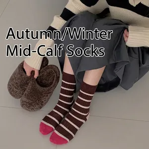 Brown and beige striped cotton crew socks with pink toe detail worn by model
