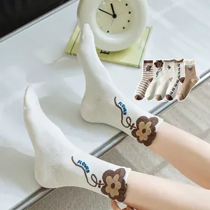 Cozy cotton floral crew socks for women featuring elegant flower embroidery and patterns
