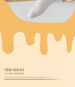 Detailed close-up showing the fine knit texture and reinforced toe of white cotton socks