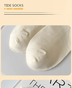 Detailed close-up showing flat toe seam and fine knit texture of cotton crew socks