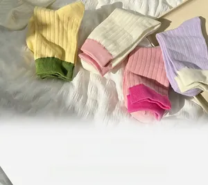 Detailed view of colorful ribbed cotton socks in vibrant contrasting color combinations