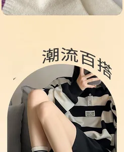 Close-up of white crew socks with black stripes on woman sitting on sofa