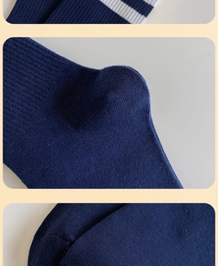 Detailed macro view of dark blue striped cotton socks featuring reinforced heel and smooth toe seam