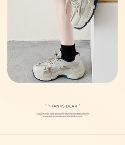 Close-up of minimalist off-white sneakers with mesh texture and blue contrast lining