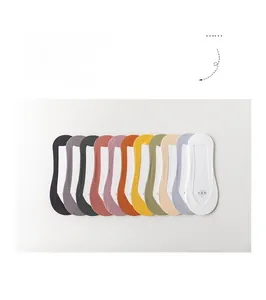 Detail showing flat-laid colorful seamless low-cut liner socks in diverse bright shades