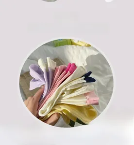 Detailed view of colorful ribbed cotton socks set in purple pink and yellow tones