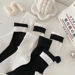 Solid cotton mid-calf socks in minimalist black and white stripes for women daily wear