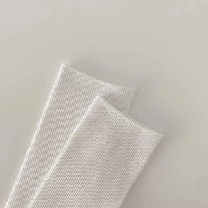White ribbed knit mid-calf cotton socks with minimalist vertical striped texture