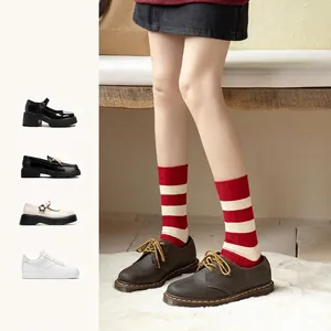 Thick cashmere red striped socks for winter warmth, styled with vintage brown shoes