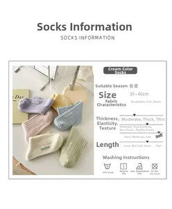 Macro view showing macaron color palette and embroidered hello detail on cotton socks