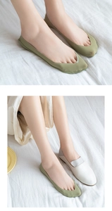 Detail of olive green no-show socks showing thin breathable material and seamless fit