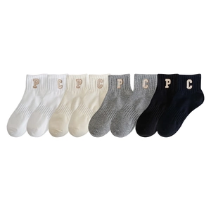Set of four cotton crew socks in white, beige, grey, and black with letter embroidery