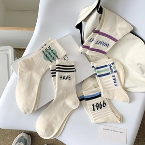 Five-pack white cotton crew socks with minimalist slogans and sporty stripes