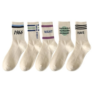 5-pack cream cotton crew socks with athletic stripes, polka dots, and letter patterns