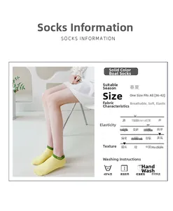 Detail of yellow cotton no-show sock with green Smile embroidery and elastic cuff
