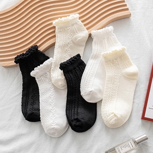 Five pairs of white and black women's ruffle ankle socks with heart hollow patterns