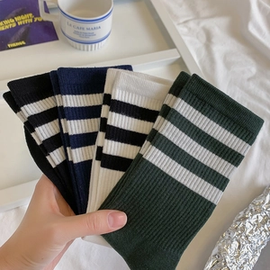 Set of four cotton striped crew socks in black, navy, white, and dark green colors