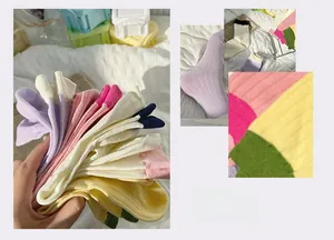 Macro detail of ribbed knit cotton socks in assorted pastel macaron colors for women