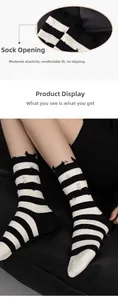 Detailed close-up showing the distressed hole design and elastic cuff of the striped socks