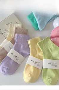 Detail of organic combed cotton mid-calf socks in various bright pastel candy colors