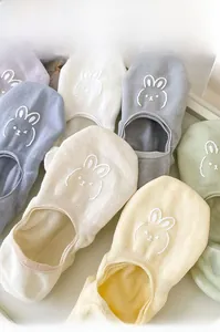 Flat lay of colorful no-show socks with rabbit embroidery in assorted macaron pastel tones