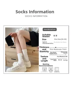 Detail view of breathable embroidered crew socks with size and fabric specifications