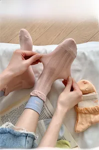 Detail of breathable mesh knit crew socks showing high elasticity and ribbed cuffs