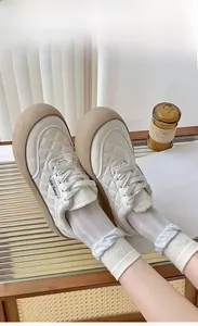 Quilted low-top platform sneakers in creamy white with gum sole and ribbed white socks
