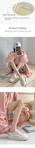 Detail of pink and beige cotton knit socks showing rib cuff elasticity and vertical texture