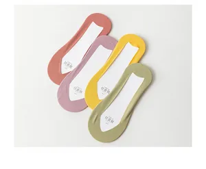 Detail of four colorful invisible liner socks showing seamless laser-cut edges and shape