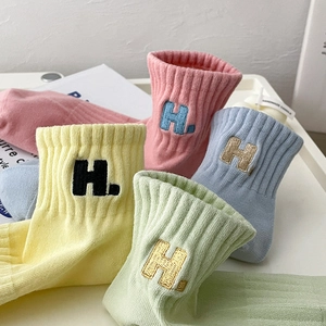 Colorful sports socks with H-letter embroidery and ribbed knit texture in candy colors