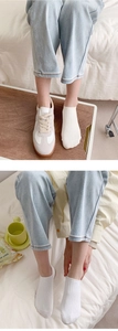 White ribbed cotton invisible socks shown with sneakers and denim for casual wear