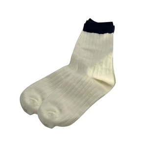 Women's crew socks with cream white body and navy blue contrast ribbed cuffs in flat lay