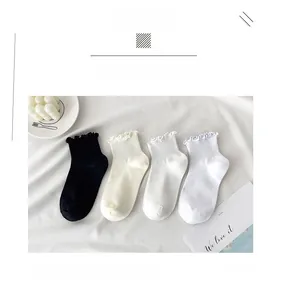 Close-up of four colors ruffle edge ankle socks with vertical ribbed knit textures
