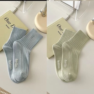 Ribbed knit crew socks with hello embroidery in light blue and green cotton fabric