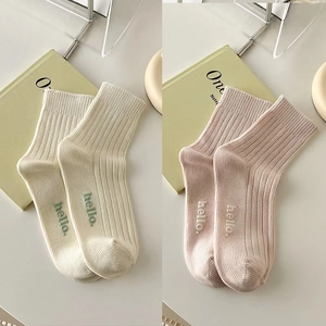 Breathable cotton crew socks with hello embroidery and vertical knit texture in cream and pink