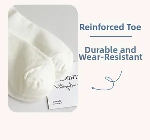 Close-up of reinforced toe detail on white cotton high socks for durability