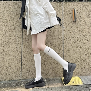 White knee-high socks with black clover embroidery in Japanese preppy school style