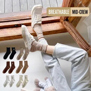 Women's crew socks with rabbit embroidery in six natural earth tones and ribbed texture