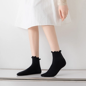 Japanese style black cotton socks with lettuce edge ruffle and ribbed design for women