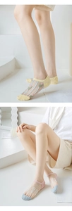 Detailed close-up of breathable mesh crystal silk socks with floral patterns for women