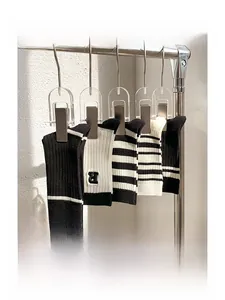 Detail of pure cotton ribbed socks with double needle knit and striped patterns