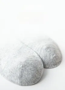 Detailed close-up of 3D stereoscopic toe design on grey combed cotton crew socks