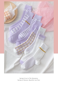 Close-up of 6-pack purple cotton socks featuring stripe, plaid and knit textures