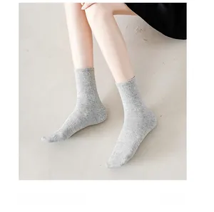 Detail of grey crew socks with fine ribbed texture in combed cotton for daily wear