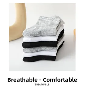 Detail of soft breathable ribbed cotton socks in white grey and black colors