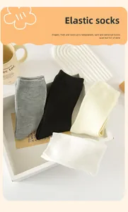 Detail of high-elasticity ribbed cuffs on various solid-colored cotton crew socks