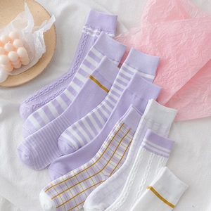 Assorted purple and white striped cotton socks set in a soft aesthetic flat lay