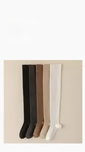 Detail view of five assorted color over-knee high socks in premium knit cotton fabric