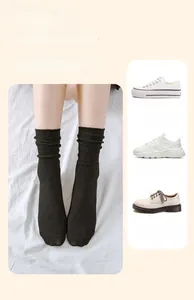 Three style pairings of black ribbed mid-calf socks with sneakers and casual shoes